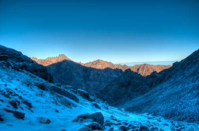 Promising sunrise above frozen land near Jebel Toubkal
