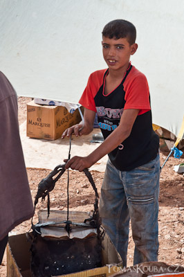 A boy preparing popcorn